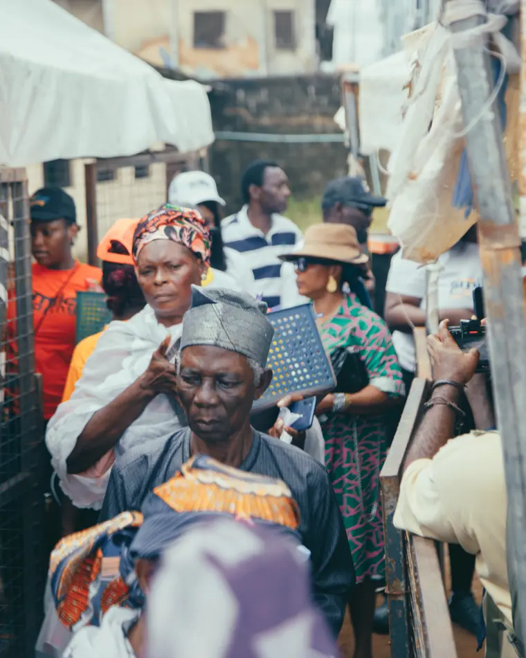 An elderly man receives a relief basket.