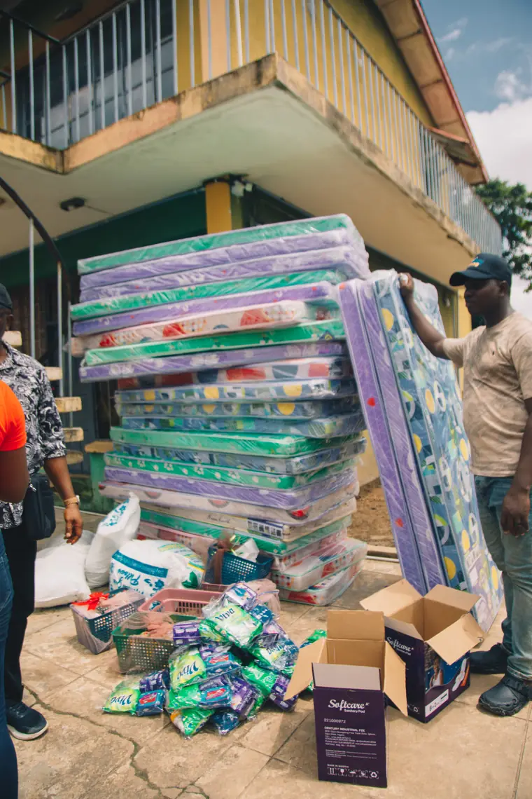 Mattresses carried in for the girls at the centre.