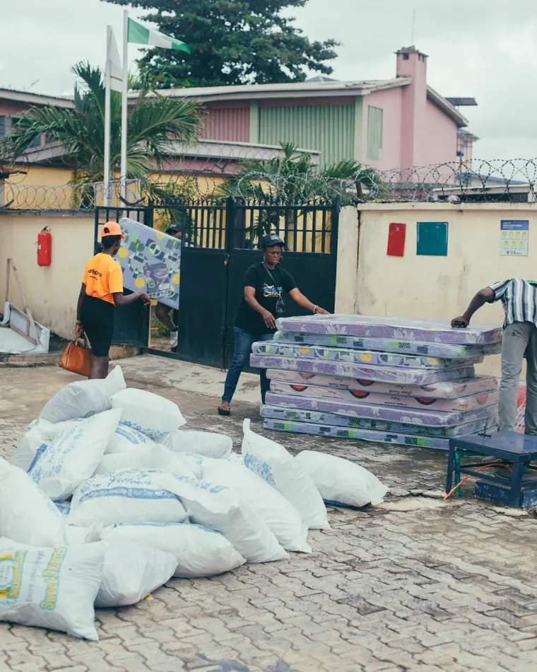 Mattresses and food supplies staged for delivery.