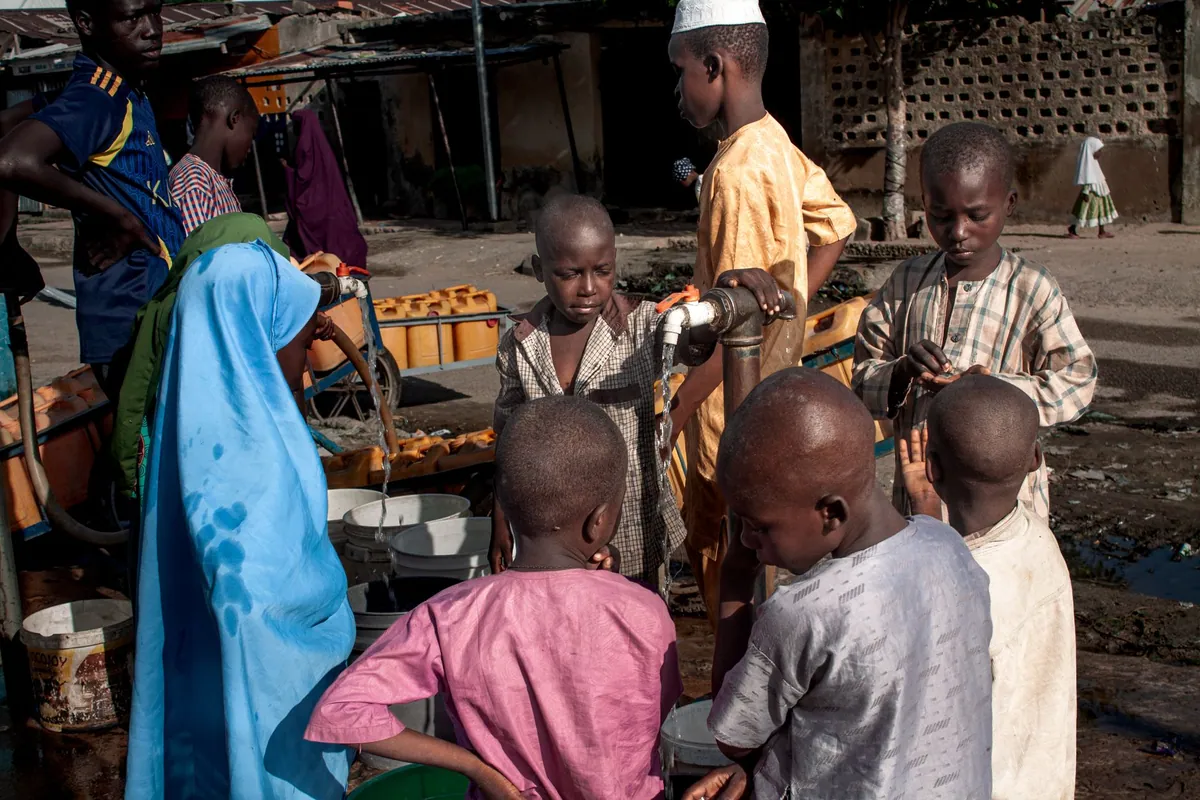 Children gathered around a community water point.