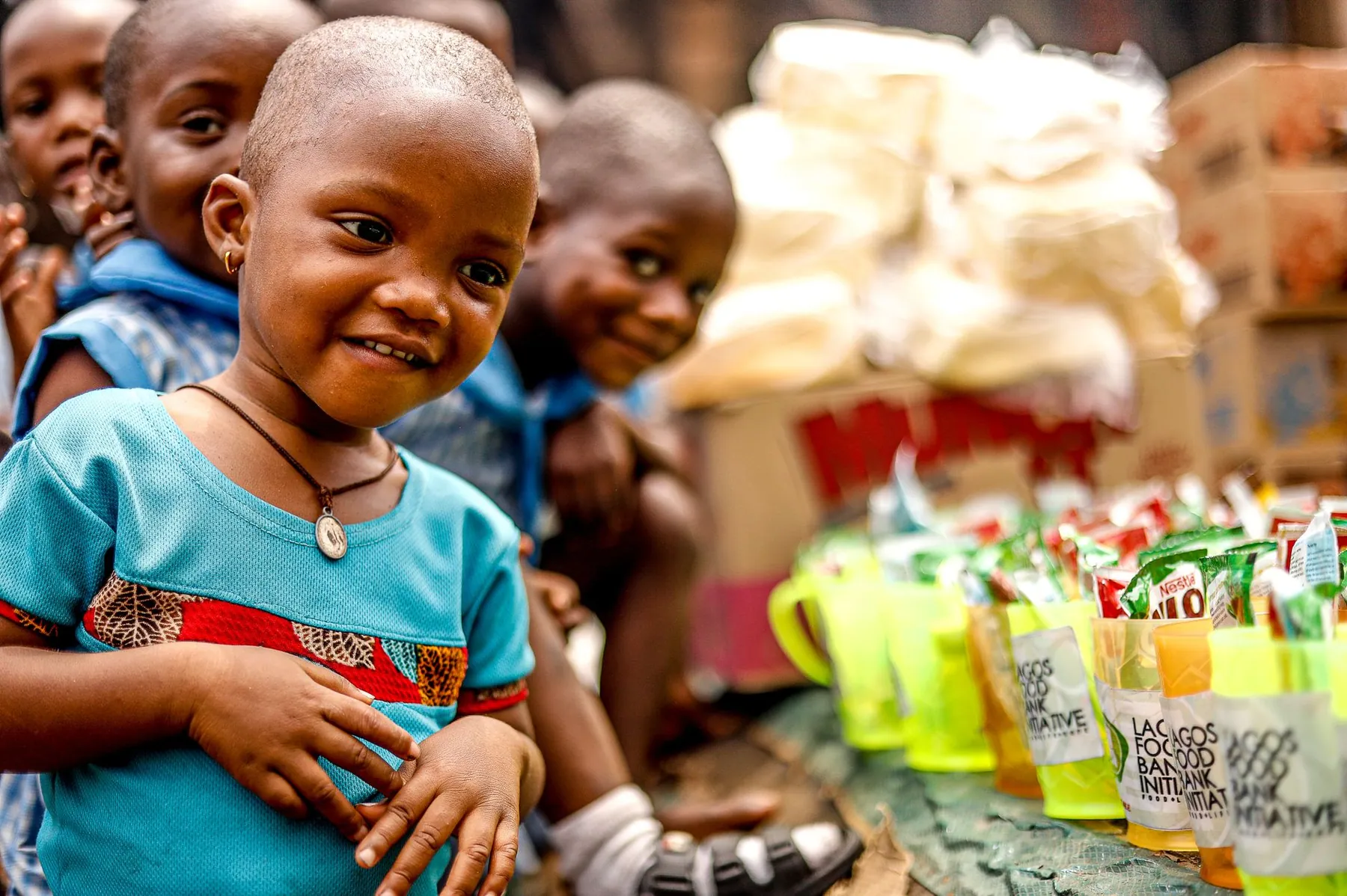 Children laughing together at a community event in Lagos.